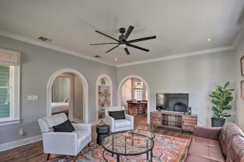 a living room with a couch and a ceiling fan at Historic Home with Yard Near St Marys Strip! in San Antonio