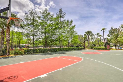 an outdoor basketball court with a basketball hoop at Cheery Condo with Community Pool and Waterslide! in Pine Bluff