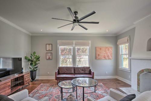 a living room with a couch and a ceiling fan at Historic Home with Yard Near St Marys Strip! in San Antonio