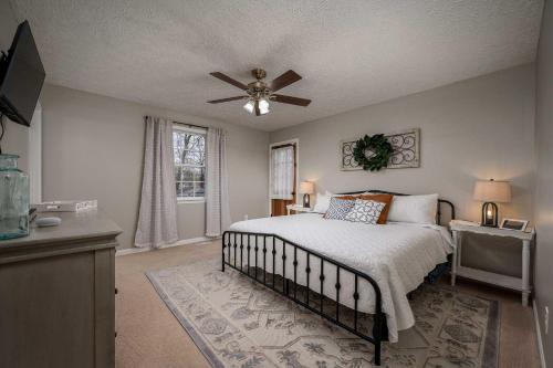 a bedroom with a bed and a ceiling fan at Single-Story Manchester Home Close to Parks! in Manchester