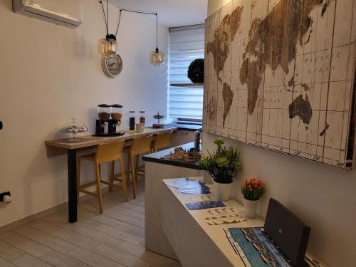 a kitchen with a large map of the world on the wall at Struttura Re Barbaro in Porto Torres