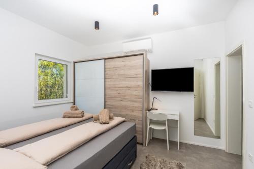 Giường trong phòng chung tại Villa Larra
