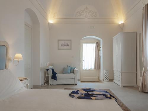 Ένα ή περισσότερα κρεβάτια σε δωμάτιο στο Palazzo Degli Abati