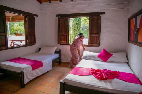 Ліжко або ліжка в номері Hotel Verano Resort San Gil