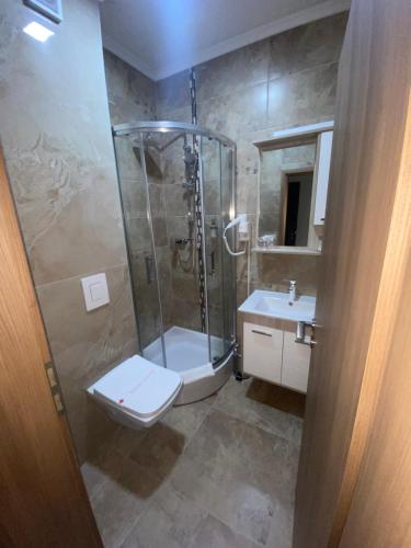 Kylpyhuone majoituspaikassa HOTEL New Milenium
