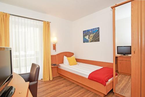 Foto Ferienwohnungen Berganemone 2