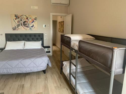 a room with two bunk beds and a hallway at B&B IV Vico in Miglianico