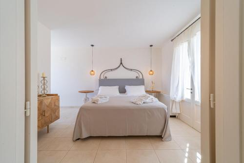 A bed or beds in a room at Tenuta Centoporte