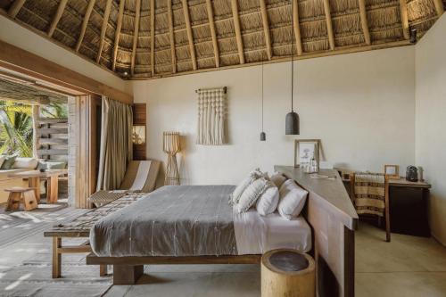 Postel nebo postele na pokoji v ubytování Hotel Ma'xanab Tulum