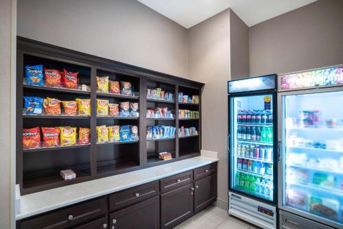 a store with a snack aisle with a refrigerator at La Quinta by Wyndham West Memphis in West Memphis