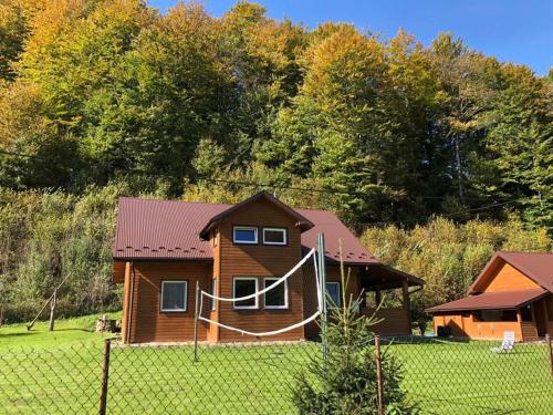 a house with a net in front of it at Bieszczadzki Klin BKLIN in Cisna