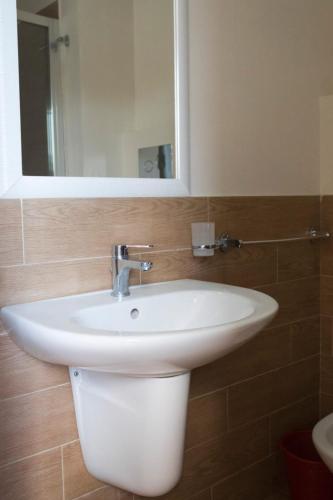 a bathroom with a white sink and a mirror at Villa Azzurra Scale of the Turks in Realmonte