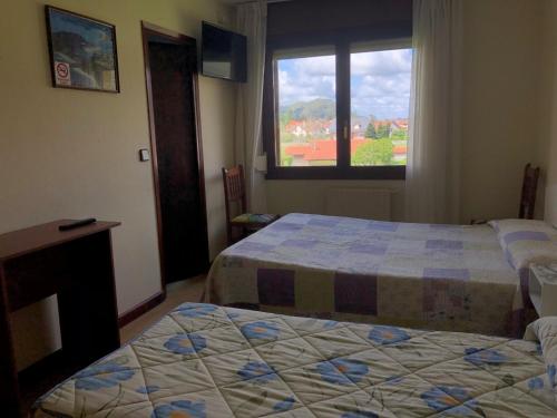 Postel nebo postele na pokoji v ubytování Hotel Costa Cántabra