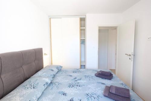 Postel nebo postele na pokoji v ubytování Apartment Smile