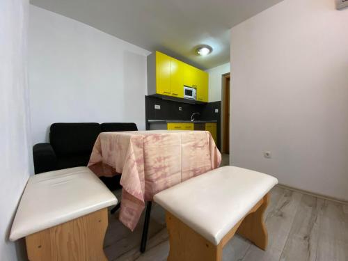 a small kitchen with a table and two chairs at Lighthouse in Vodice