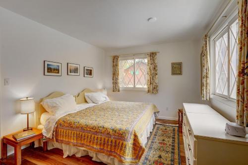 a bedroom with a bed and a window at Fall River Casita in Estes Park