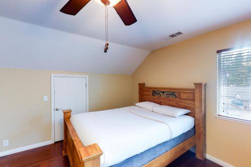 a bedroom with a bed and a ceiling fan at Calandri Lakeview House in Bass Lake