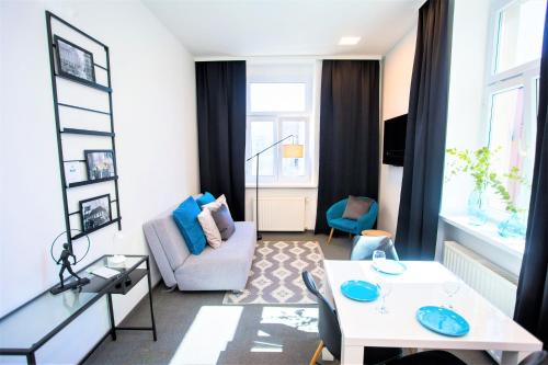 a living room with a couch and a table at Apartments DOLAC Zagreb in Zagreb