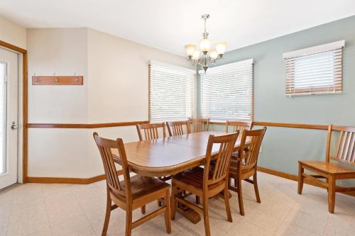 a dining room with a wooden table and chairs at Club Wyndham Shawnee Village in East Stroudsburg