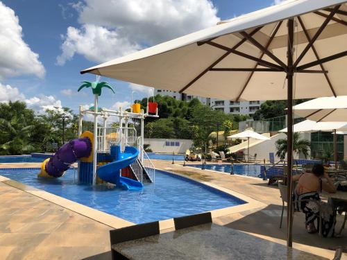 a swimming pool with a water park with a playground at Park Veredas do Rio Quente Flat 518 - Com acesso ao RIO in Rio Quente