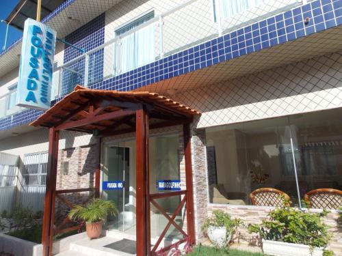 a building with awning in front of a building at Pousada Maragolfinho in Maragogi