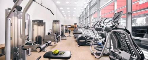a gym with rows of treadmills and machines at Royal Plaza on Scotts in Singapore