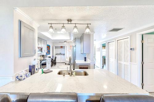 a kitchen with a sink and a counter top at Shorewood in Cape Canaveral