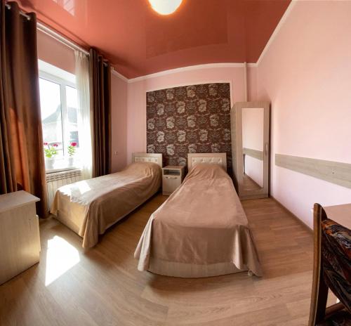Кровать или кровати в номере Отель Жылдыз