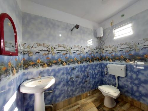 Et badeværelse på Swastik Resort Tajpur