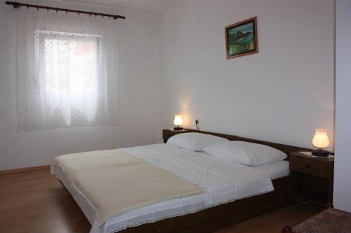 Postel nebo postele na pokoji v ubytování Apartment E&M