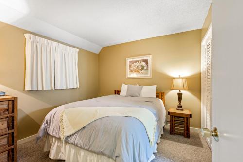 a small bedroom with a bed and a window at Myrtle Beach Resort -B-229 in Myrtle Beach