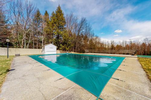 a swimming pool with a turquoise at South Village #49 in Warren