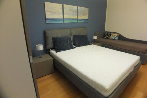 Postel nebo postele na pokoji v ubytování Appartamento luxury Gioacchino 2