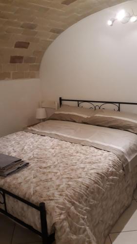 a bedroom with a bed in a room with a ceiling at Mini Location Chieti in Chieti