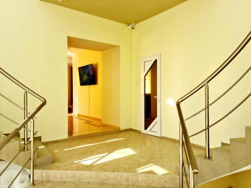 a hallway with stairs in a house at DBS Hotel in Bălţi