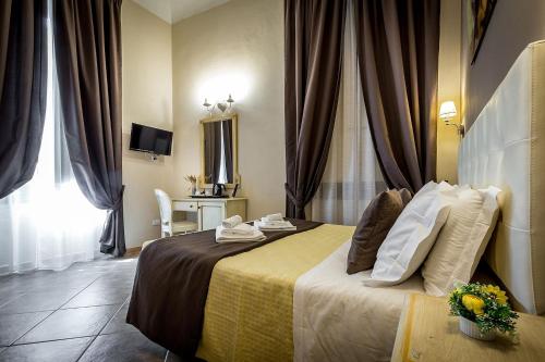 a hotel room with a bed and a window at Sognando Firenze in Florence