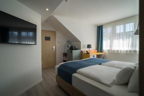 Кровать или кровати в номере Hotel Civitas