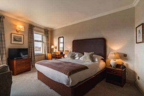 Säng eller sängar i ett rum på Inver Lodge