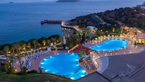 an aerial view of a resort with a swimming pool at Yasmin Bodrum Resort in Gümüşlük