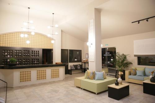 a living room with a couch and a table at Anastasia Hotel Stalis in Stalida