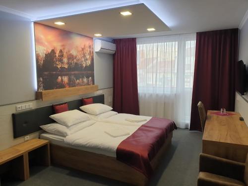 Postel nebo postele na pokoji v ubytování Hotel Strážnice