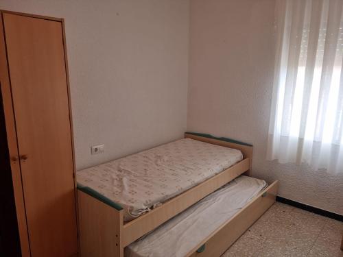 Posteľ alebo postele v izbe v ubytovaní APARTAMENTO LEO