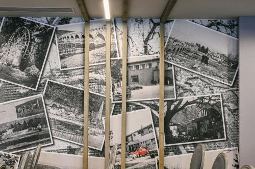 a wall full of pictures on a wall at Hotel Buna Mostar in Buna