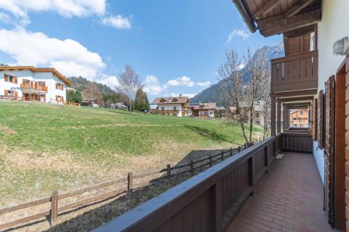 a balcony with a view of a field at Casa Maura in Soraga