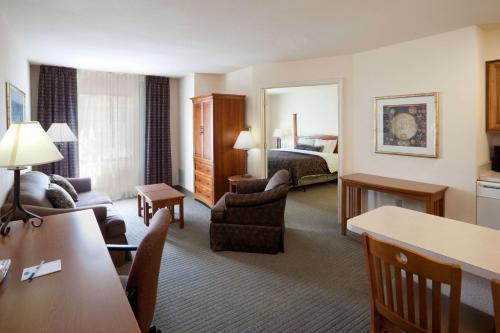 a hotel room with a living room with a bed at Sonesta ES Suites San Antonio Northwest Medical Center in San Antonio