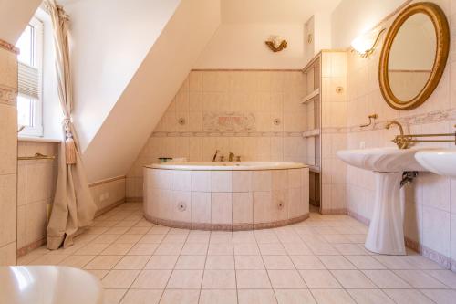 
a bathroom with a sink, toilet and bath tub at Apartamenty nad Motławą I in Gdańsk
