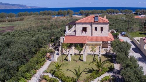 an aerial view of a house with a red roof at World Villa in Tavronitis