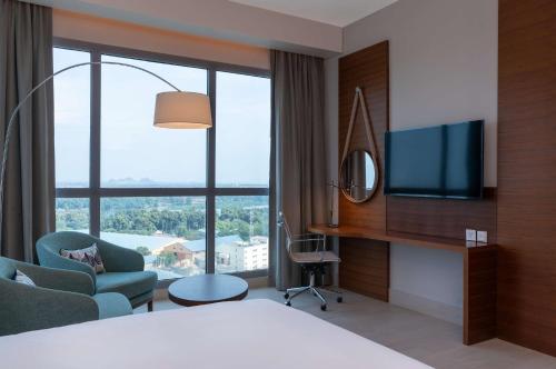 a hotel room with a bed and a television at Radisson Blu Hotel, Juba in Juba