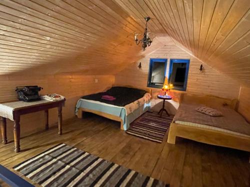En eller flere senge i et værelse på Casa Brună