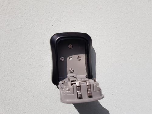 a black and silver object hanging on a wall at Ferienwohnung Stoisser in Mureck